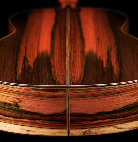 The back and lower bout of a 2022 Jose Vigil classical guitar made of spruce and CSA rosewood.