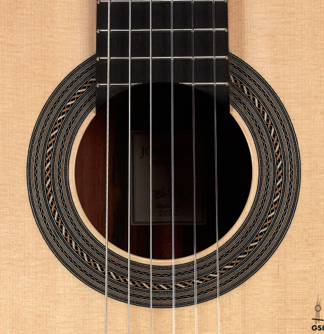 The rosette of a 2022 Jose Vigil classical guitar made of spruce and CSA rosewood.