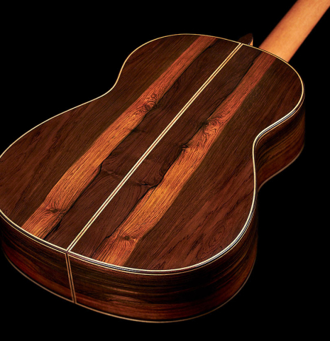 The back and sides of a 2023 Jose Vigil classical guitar made of spruce and CSA rosewood.