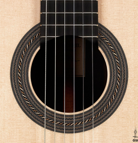 The rosette of a 2023 Jose Vigil classical guitar made of spruce and CSA rosewood.