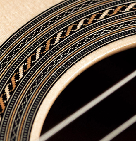 The rosette of a 2023 Jose Vigil classical guitar made of spruce and CSA rosewood.