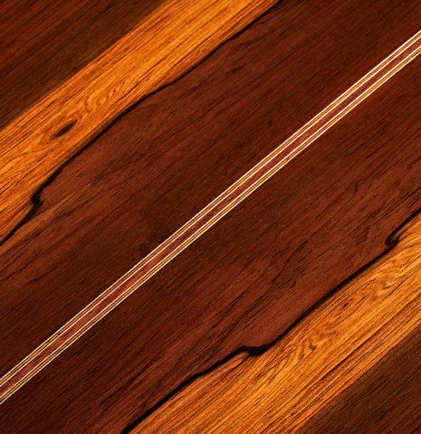The back center seam of a 2024 Jose Vigil classical guitar made of cedar and CSA rosewood.