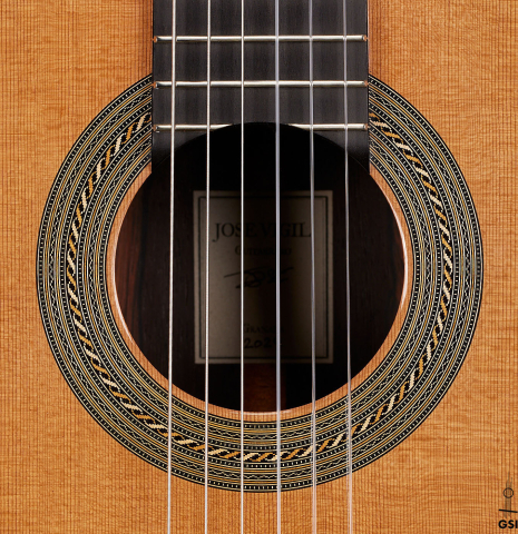 The rosette of a 2024 Jose Vigil classical guitar made of cedar and CSA rosewood.