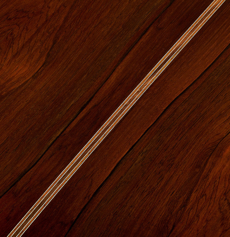 The back center seam of a 2025 Jose Vigil classical guitar made of cedar and CSA rosewood