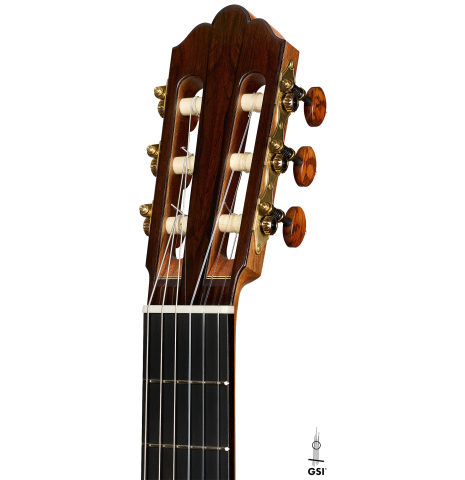 The headstock of a 2025 Jose Vigil classical guitar made of cedar and CSA rosewood