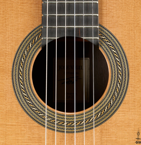 The rosette of a 2025 Jose Vigil classical guitar made of cedar and CSA rosewood
