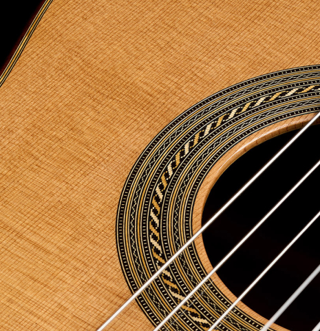 The soundboard and rosette of a 2025 Jose Vigil classical guitar made of cedar and CSA rosewood
