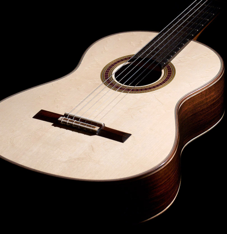 The soundboard of a 2022 Otto Vowinkel classical guitar made with spruce soundboard and CSA rosewood.