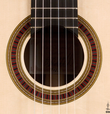 The rosette of a 2022 Otto Vowinkel classical guitar made with spruce soundboard and CSA rosewood.