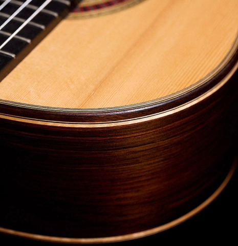 The soundboard and side of a 2015 Otto Vowinkel classical guitar made of spruce and CSA rosewood