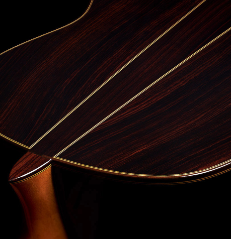 The heel and back center strip of a 2024 Otto Vowinkel "2a Double Top" classical guitar made of cedar and Indian rosewood