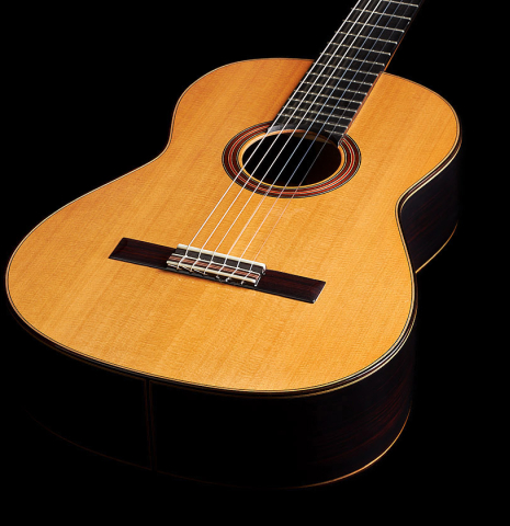 The soundboard and sides of a 2024 Otto Vowinkel "2a Double Top" classical guitar made of cedar and Indian rosewood