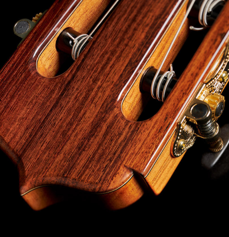 The headstock and tuning machines of an Otto Vowinkel "2a Baritone" classical guitar made with spruce top and Indian rosewood back and sides.