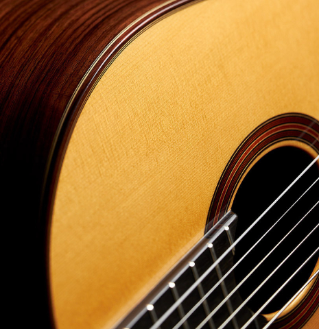 The top and side of an Otto Vowinkel "2a Baritone" classical guitar made with spruce top and Indian rosewood back and sides.