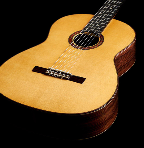 The soundboard of an Otto Vowinkel "2a Baritone" classical guitar made with spruce top and Indian rosewood back and sides.