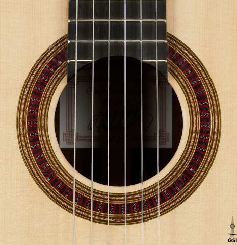 The rosette of a 2025 Otto Vowinkel classical guitar made with spruce and cocobolo