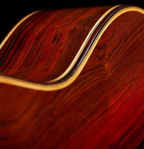 The back binding and purflings of a 2025 Otto Vowinkel classical guitar made with spruce and cocobolo