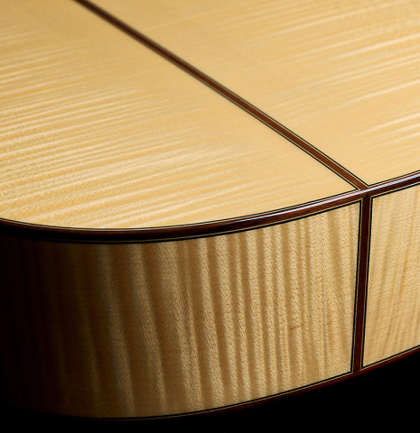 The back and sides at the foot of an Otto Vowinkel "2a" classical guitar made with spruce top and maple back and sides.