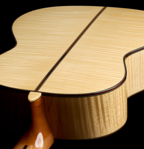 The heel, back binding and purfling of an Otto Vowinkel "2a" classical guitar made with spruce top and maple back and sides.