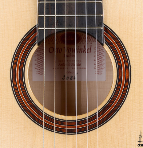 The rosette of an Otto Vowinkel "2a" classical guitar made with spruce top and maple back and sides.