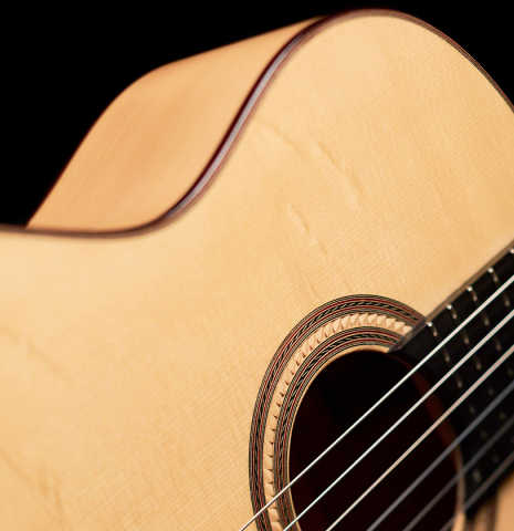The rosette, spruce soundboard and cypress side of a 2022 Angela Waltner classical guitar.