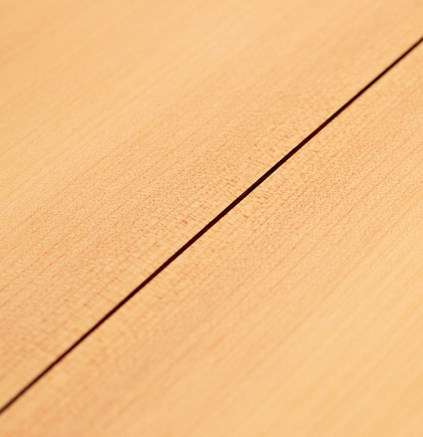 A close-up photo of the cypress back of a 2022 Angela Waltner classical guitar.