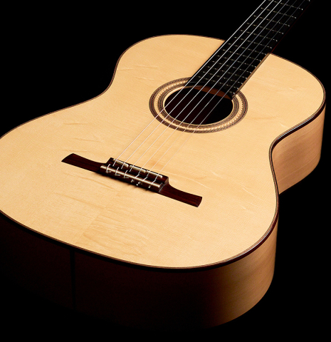 The front of a 2022 Angela Waltner classical guitar made with spruce and cypress wood.