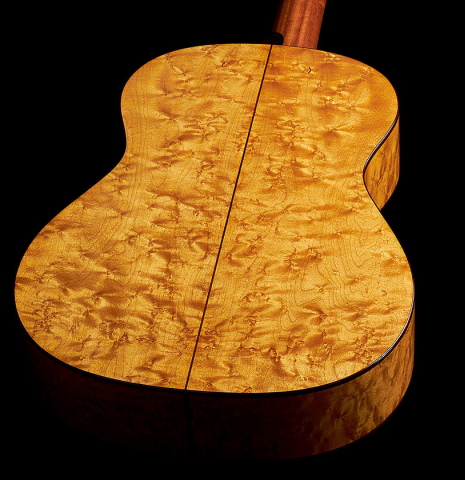 The back and sides at the foot of a 2023 Angela Waltner "Anima" classical guitar made of spruce and maple