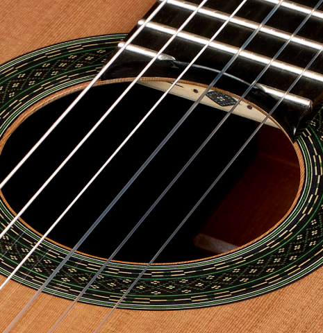 The rosette and upper harmonic bar inlay of a 2025 Julia Wenzel classical guitar made of cedar and CSA rosewood
