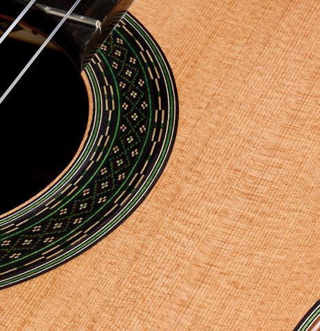 The soundboard and rosette detail of a 2025 Julia Wenzel classical guitar made of cedar and CSA rosewood