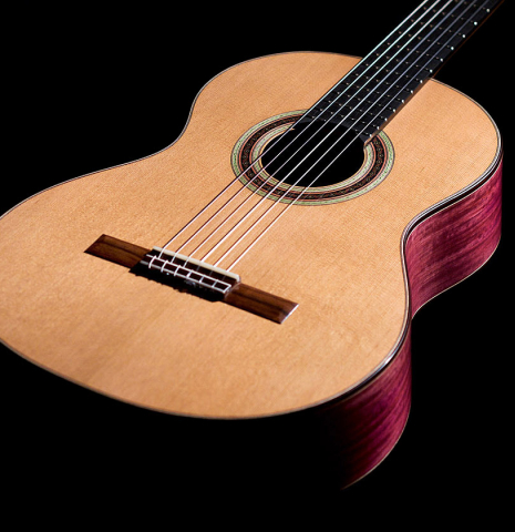 The soundboard of a 2022 Julia Wenzel classical guitar made of cedar and purpleheart wood