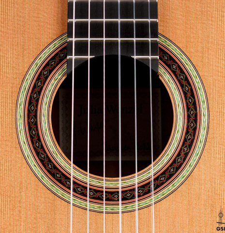 The rosette of a 2022 Julia Wenzel classical guitar made of cedar and purpleheart wood