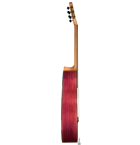 The side of a 2022 Julia Wenzel classical guitar made of cedar and purpleheart wood