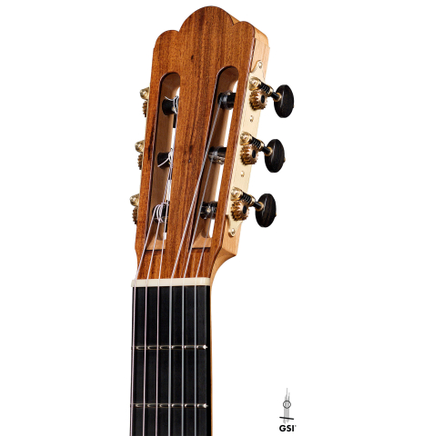 The headstock of a 2022 Julia Wenzel classical guitar made of cedar and purpleheart wood