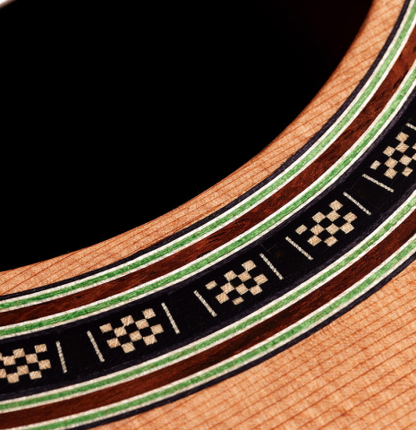 Close-up detail of the rosette of a 2024 Julia Wenzel classical guitar made of cedar and African rosewood