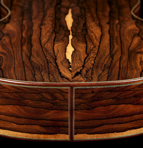 The back and sides at the foot of a 2024 Julia Wenzel classical guitar made of spruce and ziricote