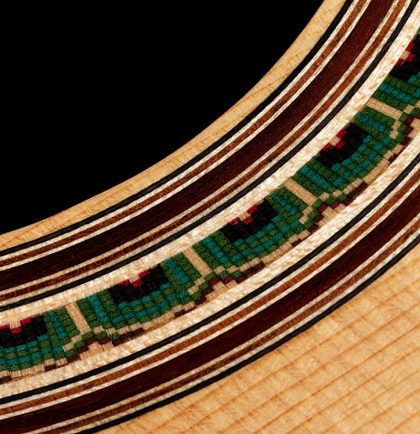 Detailed close-up of the rosette of a 2024 Julia Wenzel classical guitar made of spruce and ziricote