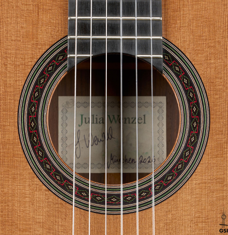 The rosette of a 2026 Julia Wenzel classical guitar made of cedar and Indian rosewood