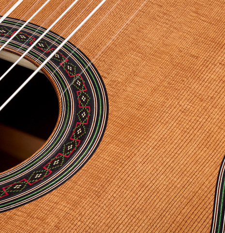 The top and rosette of a 2026 Julia Wenzel classical guitar made of cedar and Indian rosewood