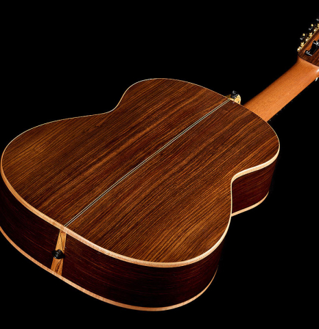 The back and sides of a 2023 Ken Whisler classical guitar made of spruce and Indian rosewood