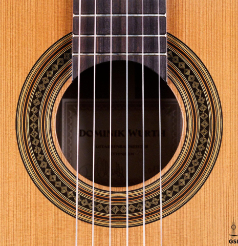 The rosette of a 2019 Dominik Wurth classical guitar made of cedar and Indian rosewood