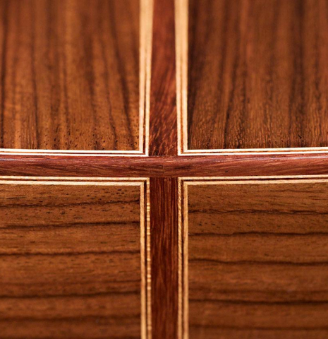 The back and binding of a 2019 Dominik Wurth classical guitar made of cedar and Indian rosewood