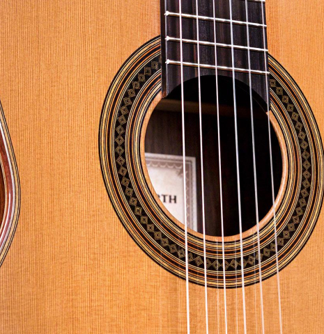 The soundboard and rosette of a 2019 Dominik Wurth classical guitar made of cedar and Indian rosewood