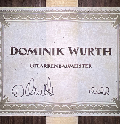 The label of a 2022 Dominik Wurth classical guitar made with cedar and Indian rosewood