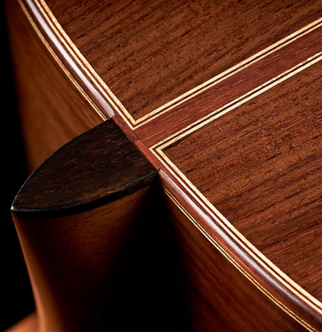 The back, heel, binding and purfling of a 2023 Dominik Wurth classical guitar made of spruce and Indian rosewood