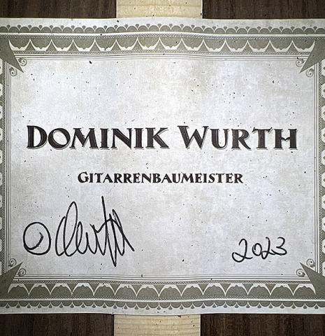 The label of a 2023 Dominik Wurth classical guitar made of spruce and Indian rosewood