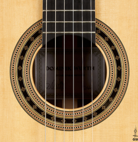 The rosette of a 2023 Dominik Wurth classical guitar made of spruce and Indian rosewood
