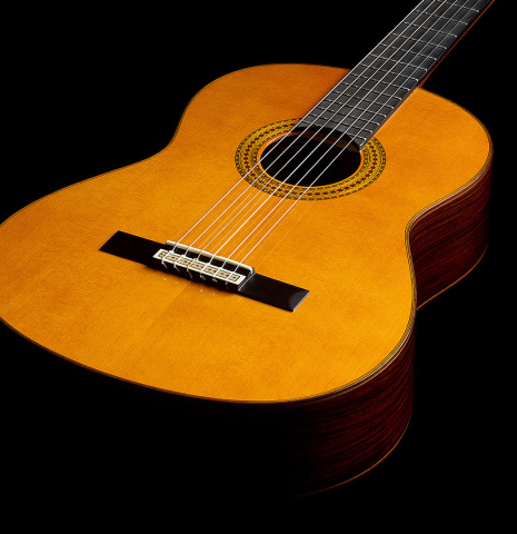 The soundboard of a 2025 Yamaha "Grand Concert GC22" classical guitar made of cedar and Indian rosewood