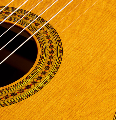 The top and rosette detail of a 2025 Yamaha "Grand Concert GC22" classical guitar made of cedar and Indian rosewood