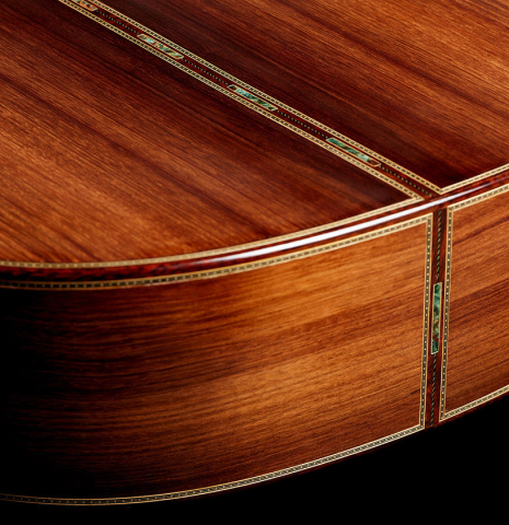 The back and sides at the foot of a 2024 Gao Yi classical guitar made of spruce and CSA rosewood
